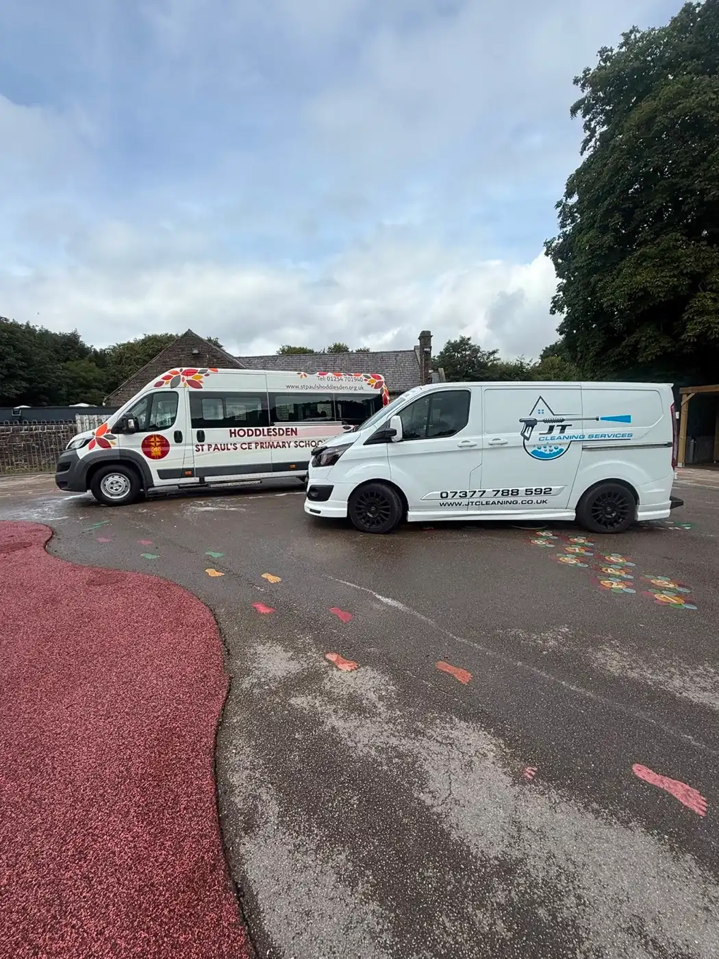 Pressure washing in progress on a residential driveway